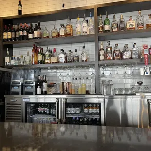 a bar with shelves of liquor
