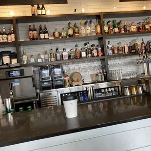 a bar with shelves of liquor