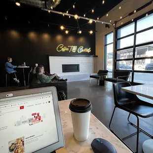 a laptop and a cup of coffee