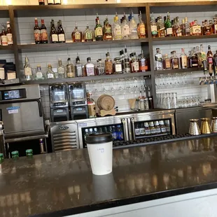 a bar with shelves of liquor