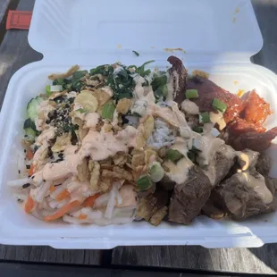 Adobo, tocino, cucumber, fried onions and garlic, spinach, white rice, spicy mayo