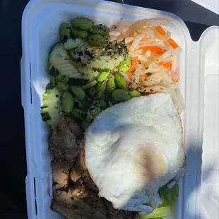 Grilled chicken on half lettuce, half noodles with lots of veggies and an egg
