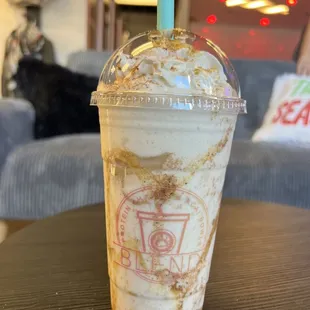 a cup of iced coffee on a table