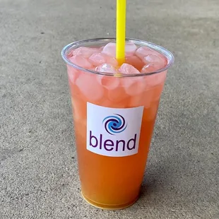 a drink with a straw in a plastic cup