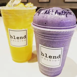 two smoothie drinks in plastic cups