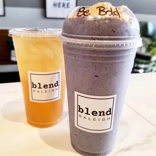 two smoothie drinks on a table