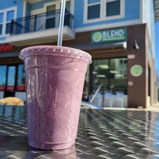 a smoothie in a plastic cup