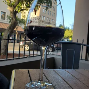 a glass of wine on a table