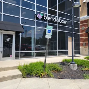 a sign in front of a building