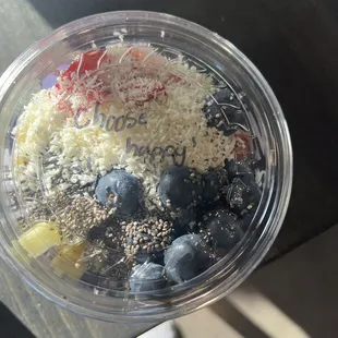 a close up of a smoothie in a plastic cup