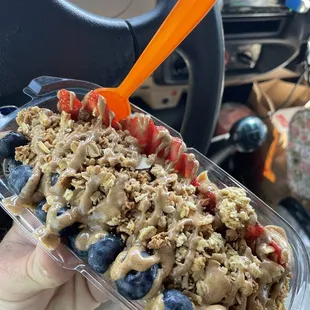 Açaí split w/ blue berries, strawberries, granola and almond butter