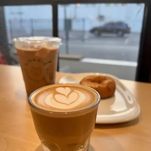 Cortado with a donut and an iced caramel latte