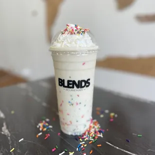 a cup of ice cream with sprinkles