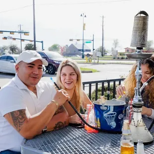 three people sitting at a table