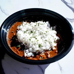 a bowl of chili and rice