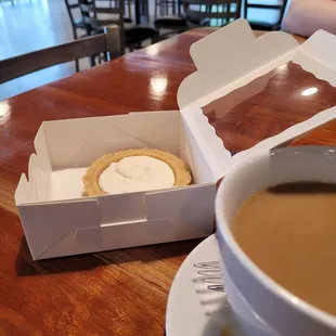 Cream cheesecake tart and coffee with cream.