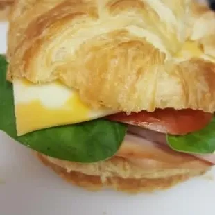 a croissant sandwich on a plate