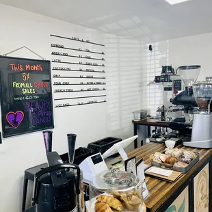 a coffee shop counter with pastries on it