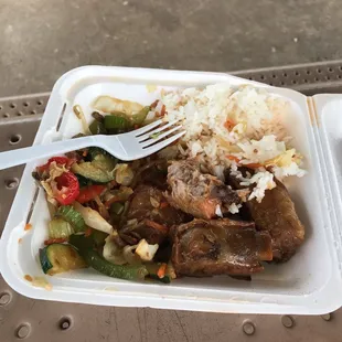 a plate of food with rice and vegetables