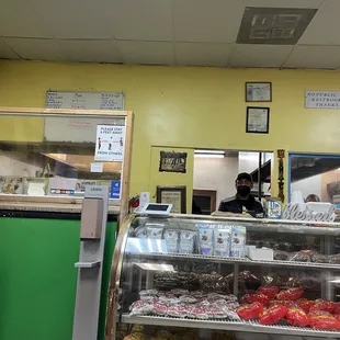 a bakery counter with a variety of pastries