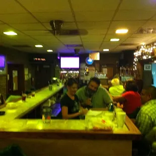 people sitting at a bar