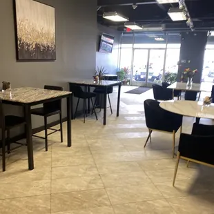 a restaurant with tables and chairs