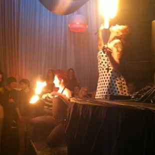 a woman holding a lit candle