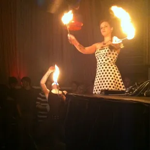 a woman juggling with fire