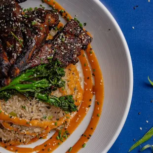 Lamb Chops over Garlic Fried Rice, broccolini and our house sweet garlic aioli