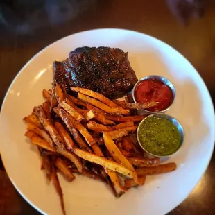 a plate of fries and a steak