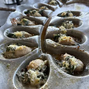 Rockefeller oysters baked with bacon,spinach and parmesan