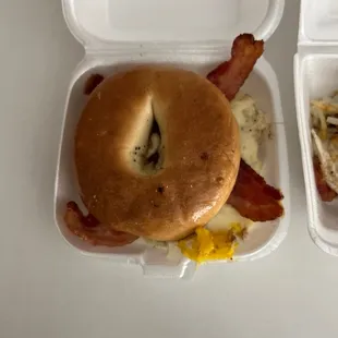 a bagel with bacon and eggs