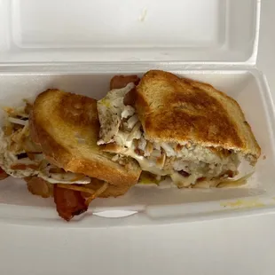 a sandwich in a styrofoam container