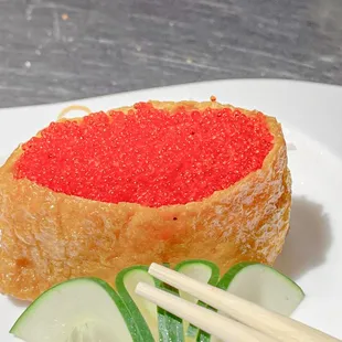 ofu Skin with Red Tobiko  New Menu ⁣⁣⁣⁣⁣⁣⁣ ⁣ ⁣⁣⁣⁣⁣⁣Inari (tofu skin) stuffed with sushi rice and red caviar.⁣