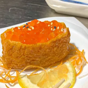 Tofu Skin with Salmon Roe  New Menu ⁣⁣⁣⁣⁣ ⁣⁣⁣⁣⁣Inari (tofu skin) stuffed with sushi rice and Ikura (salmon roe) caviar.