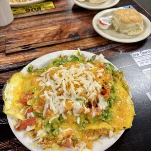 Garden scramble. It was a lot of food! The hashbrowns are under the eggs. Get the biscuit, trust me!!