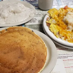 a plate of pancakes and a plate of mashed potatoes