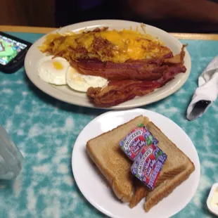 a breakfast of eggs, bacon, toast, and eggs