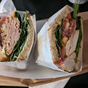 Splitting turkey and chicken club sandwiches