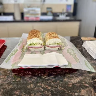 two sandwiches sitting on a table