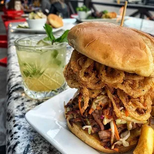 a pulled pork sandwich and french fries