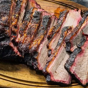 sliced brisk ribs on a cutting board