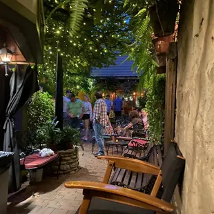 a patio area with chairs and tables
