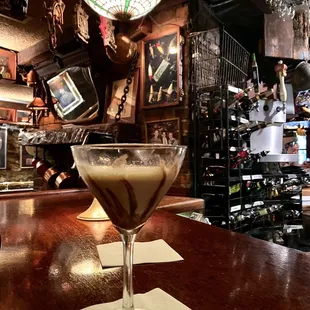 a martini on a table in a bar