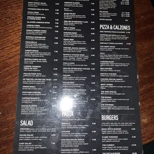 a menu for pizza and calzones