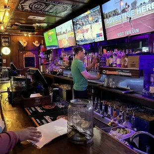 a bartender at the bar