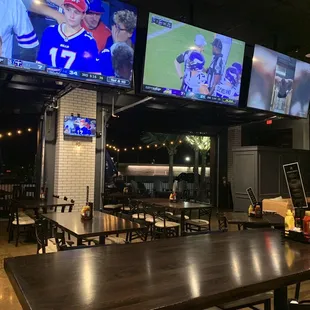 a baseball game being played on televisions