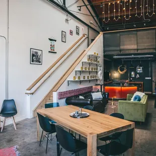 a living area with a wooden table and chairs