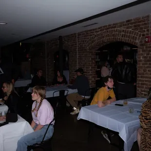 a group of people sitting at tables