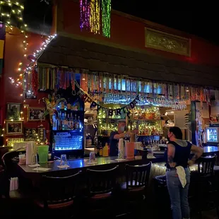 a woman sitting at a bar